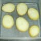 Parboiled potato slices ready for refrigerating