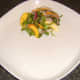 Peach and watercress salad is plated