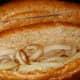 Place onions in hoagie rolls.