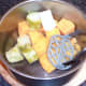 Preparing to mash sweet potato and broccoli stalk