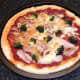 Pizza is removed from oven