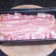 Cooked meatloaf is briefly allowed to rest in tin