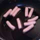 Starting to fry mini sausages