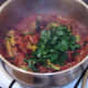 Chopped coriander is added to beef and broccoli chilli