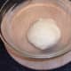 Kneaded pizza dough is left to rise