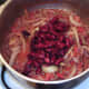 Red kidney beans are added to chilli