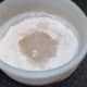 Water and oil are added to flour and yeast