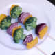 Vegetables threaded on to skewers