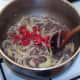 Red chilli is added to beef and onion