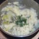 Chopped chives added to mash