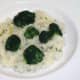 Broccoli florets are arranged on mash