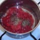 Tomatoes and seasonings added to sweated garlic