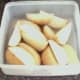 Parboiled potato wedges ready for fridge
