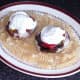 Stuffed mushrooms are laid on pasta bed