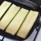 Starting to griddle strips of fresh zucchini