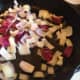 Once the butter is melted, add the onions and garlic to the pan. Allow it to cook for a few minutes.