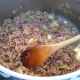 Browning the minced meat.