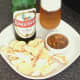 Curry and green chilli potted crayfish tails are served with mini poppadoms and Indian beer