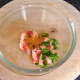 Mixing crayfish tails with green chilli and curry powder
