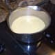 Prepare the sauce. Combine butter, flour, salt, pepper, chicken broth, and milk.