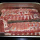 Lay the racks of ribs in a large roast pan, being careful that they don't overlap too much.