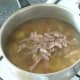 Lamb breast meat is added to soup to heat through