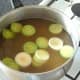 Leek stem and potato are added to strained lamb stock