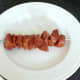Marinated pork is threaded on to skewer