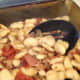 Transfer the mixture into a 8 or 9 inch baking dish. The garlic smeared on the sides will add to the taste. 