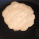 Allow the pancake to cook until the edges start to bubble and dry out a bit. You might even see a little browning. It's time to flip!