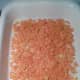 Step 2: Layer half of the crushed Doritos in the baking dish