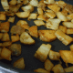 Three baked potatoes, sliced up into quarter thick pieces
