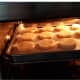 Put the tray of cookies in the toaster oven.