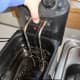 I remove the basket and the immersion heater and place them in the sink.