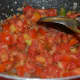 Saute the tomatoes with spices and other vegetables.