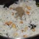 Mixing the Rice with Garlic and Other Spices 