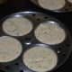 Pour the batter into the idli moulds.