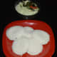 Idlis served with raw mango chutney
