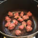It doesn't take long at all to fry the meatballs, just lightly browning them will do. 