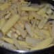 Add the baby corn pieces and continue stir-cooking.