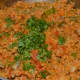 Step six: Pour lemon juice or tamarind pulp. Add chopped coriander leaves and grated coconut. Mix well. Turn off the fire.