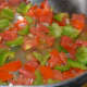 Step four: Add chopped capsicum and tomato. See that tomato does not become mushy.