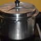 Step seven: Cover the cooker lid and cook on medium high fire till one whistle.