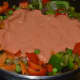 Pour the puree and stir-cook until the oil separates from the gravy. Add some salt and mix.