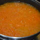 Step 6: Add food color and saffron strands. Continue cooking on low heat. Add ghee at intervals.