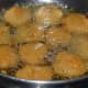 Step three: Dip the slices in the batter and deep fry them in hot oil.