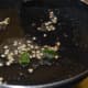 Step three: Make a tempering of mustard seeds, split black lentil, and curry leaves