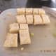 9. The tempeh should be in about 1-inch cubes. If you cut them too small, they may fall apart. Cut the onion from top to bottom into 1-inch cross sections.