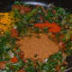 Step six: Add chole masala powder, red chili powder, turmeric powder, sugar, and salt.