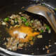 Add turmeric powder, hing, and garam masala powder. Mix well.
